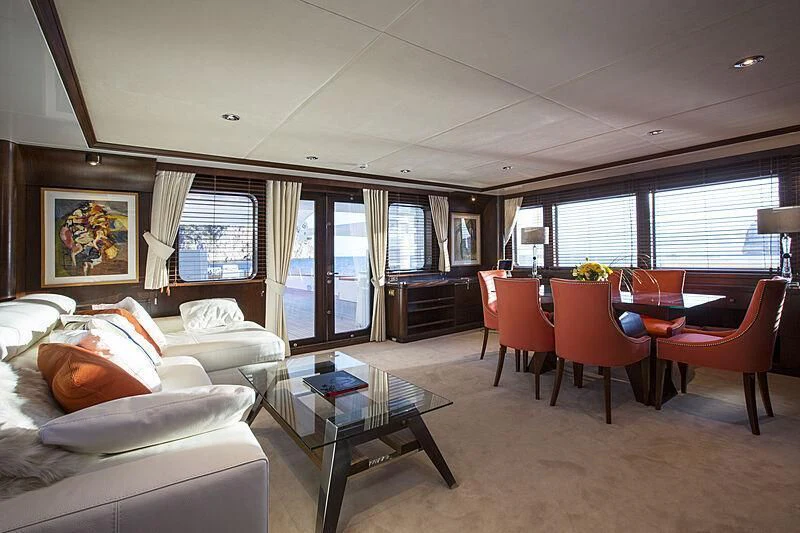 a living room with a couch and a table aboard EMERALD Yacht for Charter
