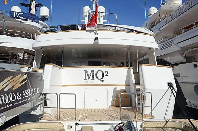 a large cruise ship docked aboard EMERALD Yacht for Charter