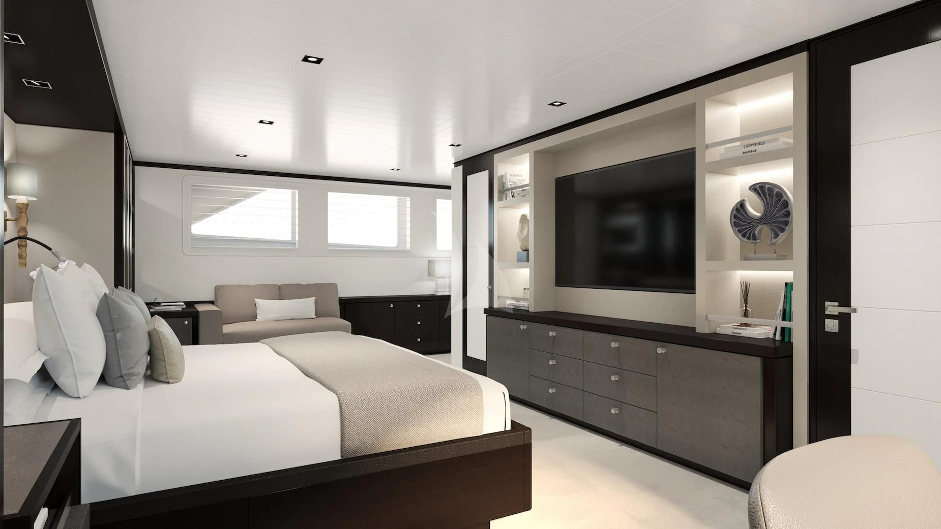 a bedroom with a bed and a tv aboard EMERALD Yacht for Charter