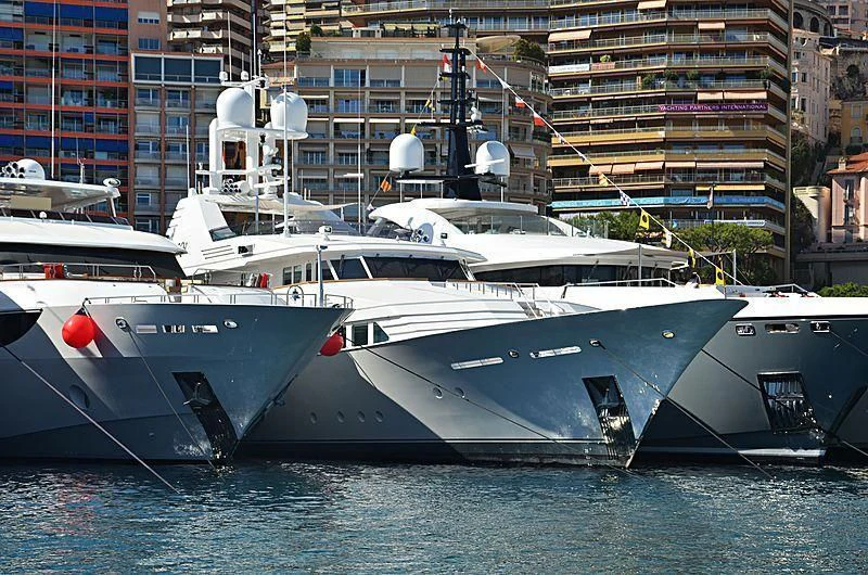 a boat docked in a harbor aboard EMERALD Yacht for Charter