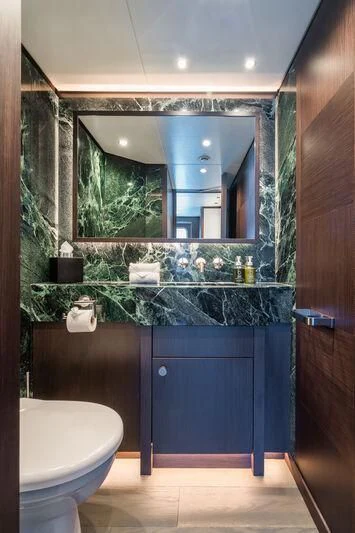 a bathroom with a large mirror aboard EMERALD Yacht for Charter