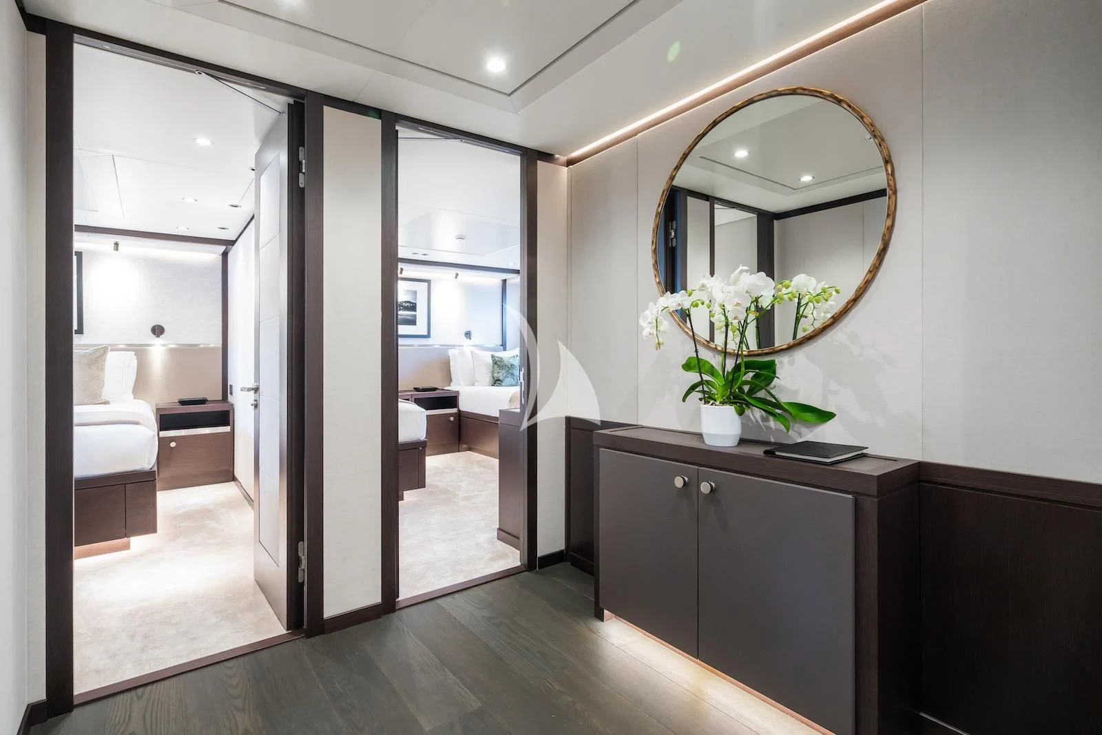 a room with a large mirror and a couch aboard EMERALD Yacht for Charter