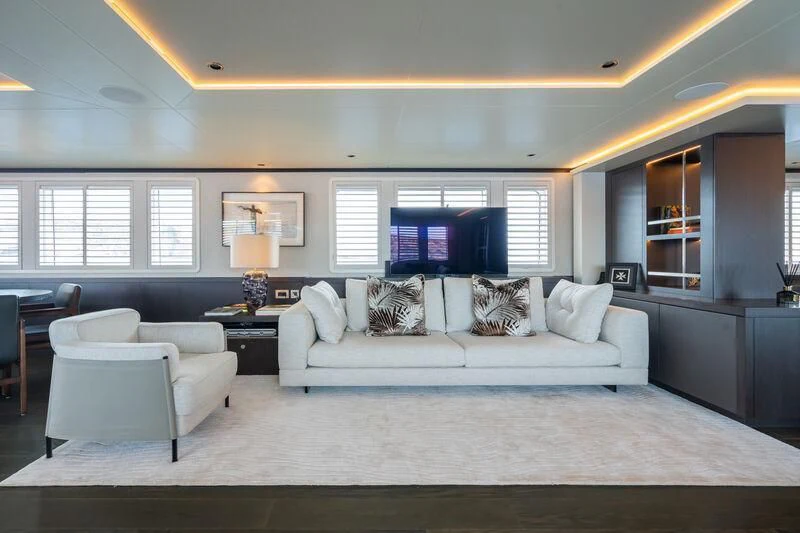 a living room with a large screen aboard EMERALD Yacht for Charter