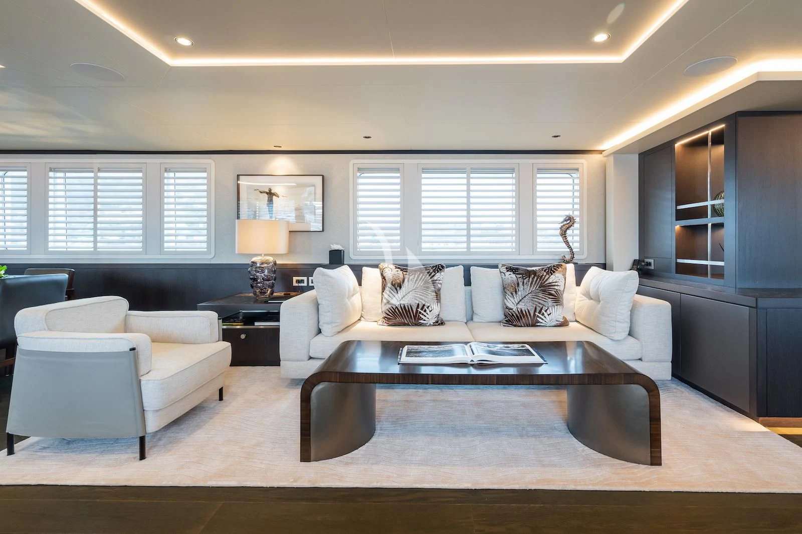 a living room with a large coffee table aboard EMERALD Yacht for Charter