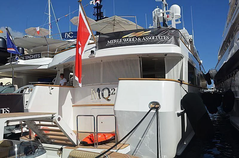 a boat with flags on it aboard EMERALD Yacht for Charter