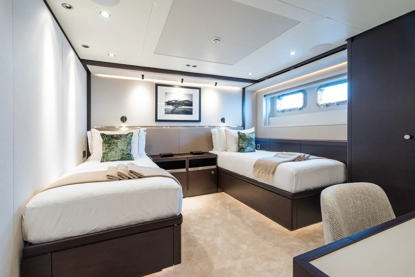 a room with two beds aboard EMERALD Yacht for Charter