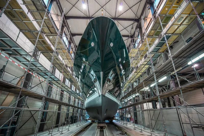 a large green metal object in a factory aboard EMERALD Yacht for Charter