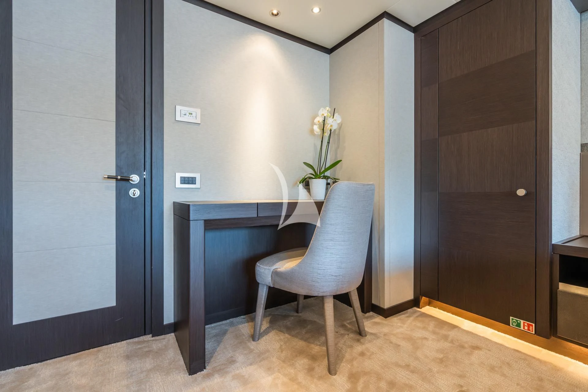 a chair and a desk in a room aboard EMERALD Yacht for Charter
