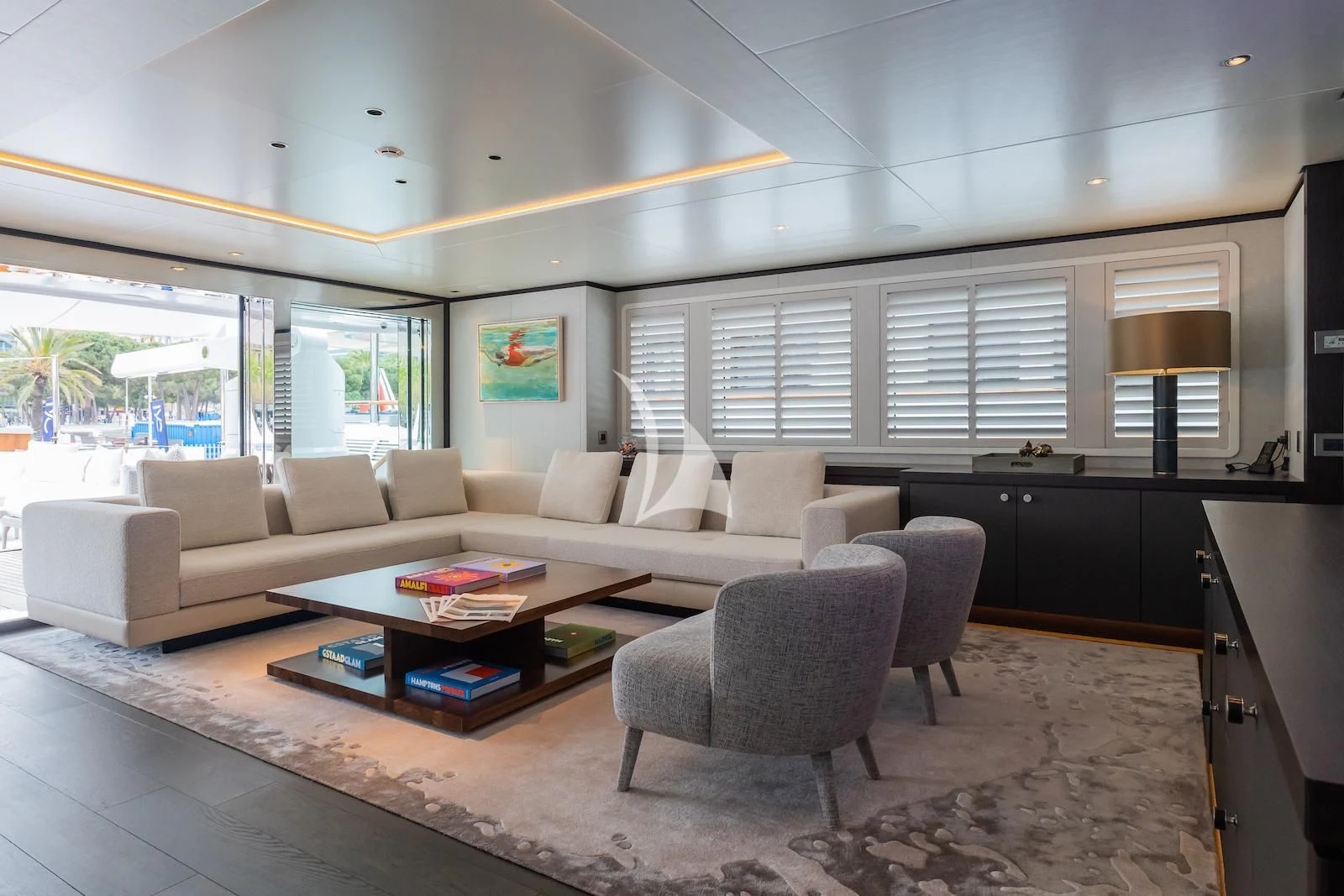 a living room with a couch and a coffee table aboard EMERALD Yacht for Charter