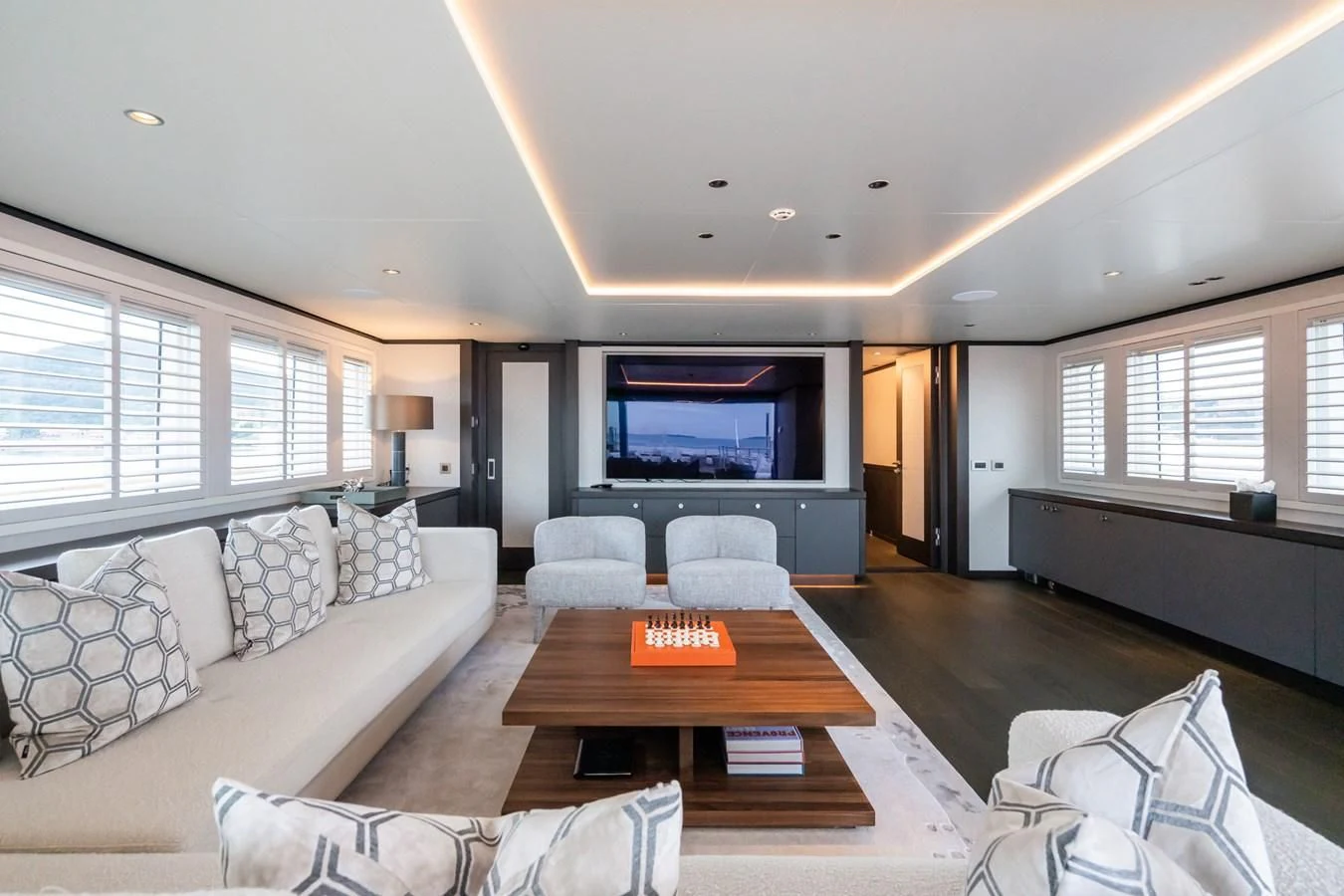 a living room with a large tv aboard EMERALD Yacht for Charter