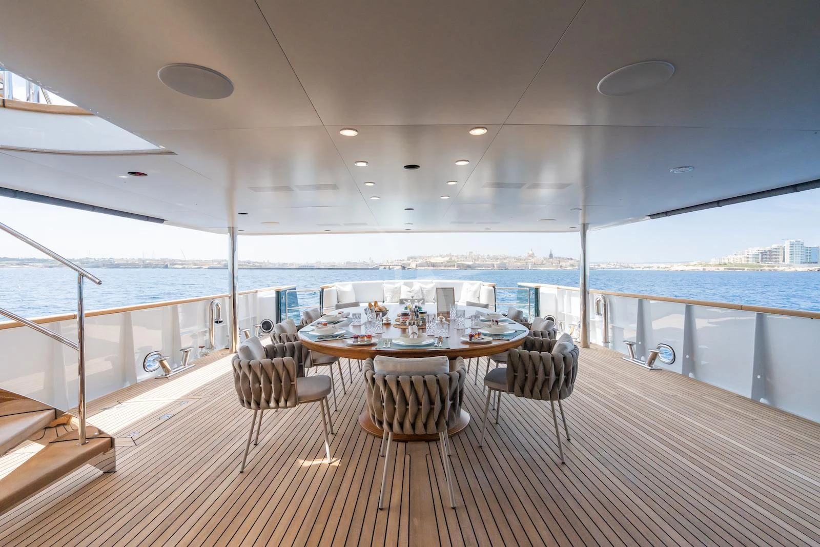 a table and chairs on a deck aboard EMERALD Yacht for Charter