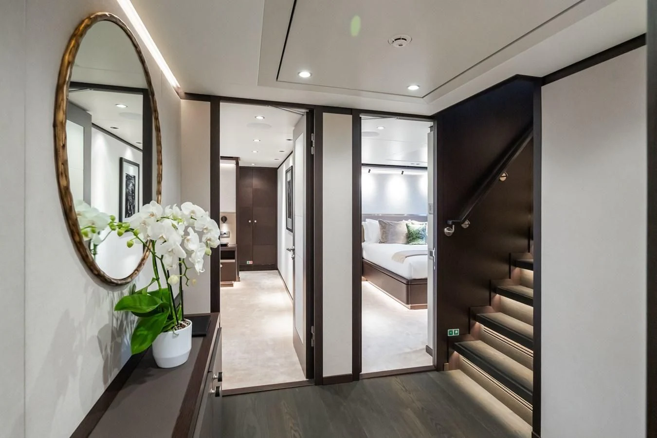 a hallway with a door and a mirror aboard EMERALD Yacht for Charter
