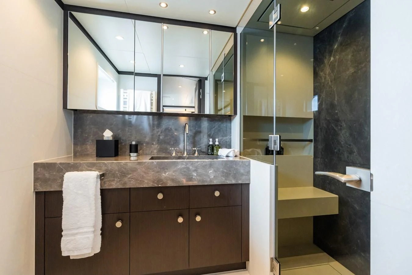 a bathroom with a sink and cabinets aboard EMERALD Yacht for Charter