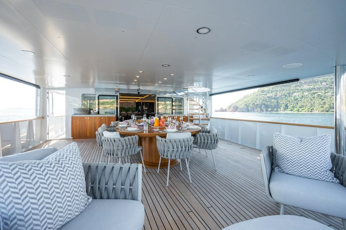 a large living room with a large window aboard EMERALD Yacht for Charter