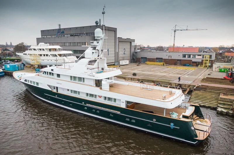 a large ship docked at a port aboard EMERALD Yacht for Charter