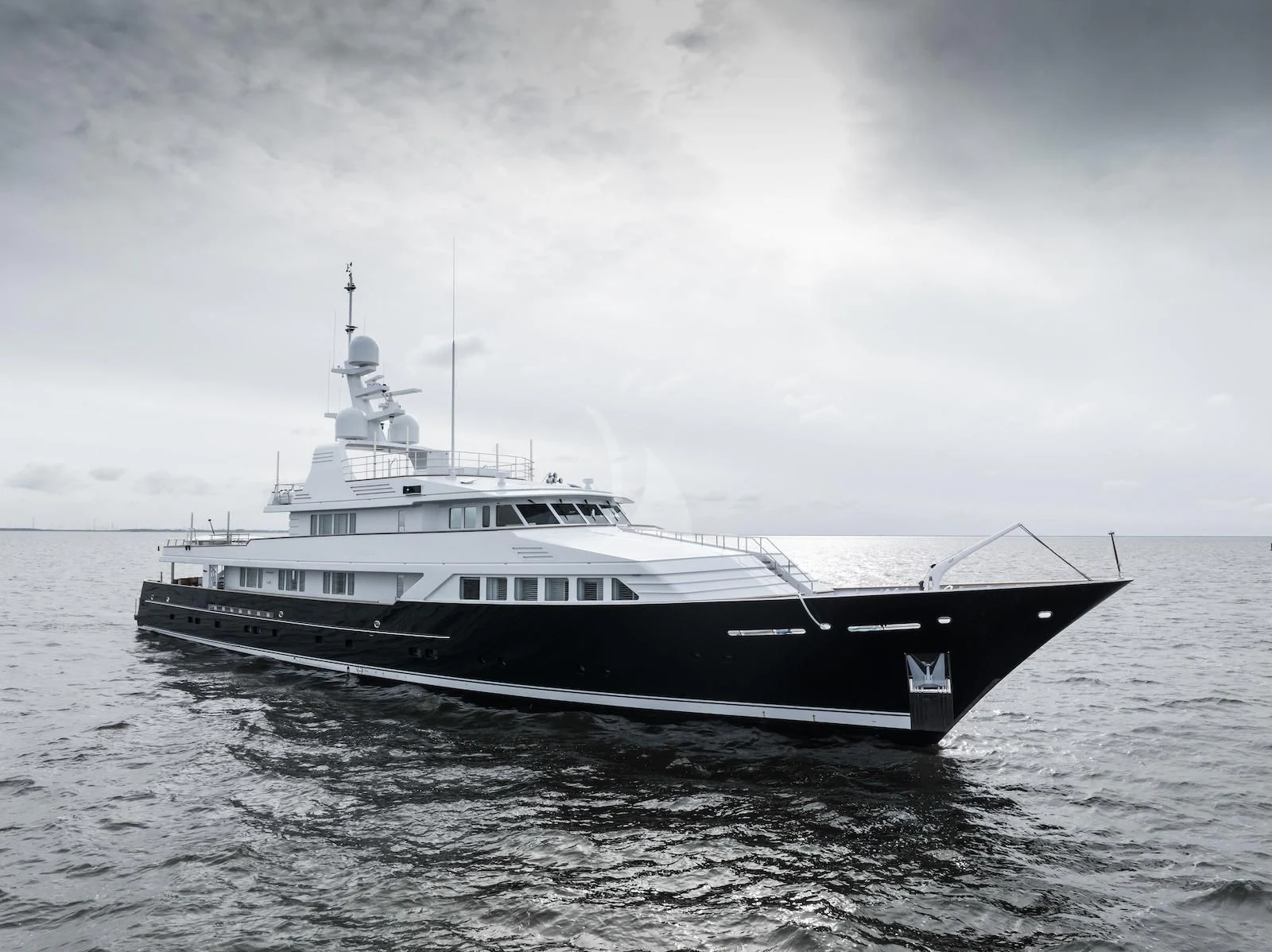 a black and white photo of a boat in the water aboard EMERALD Yacht for Charter
