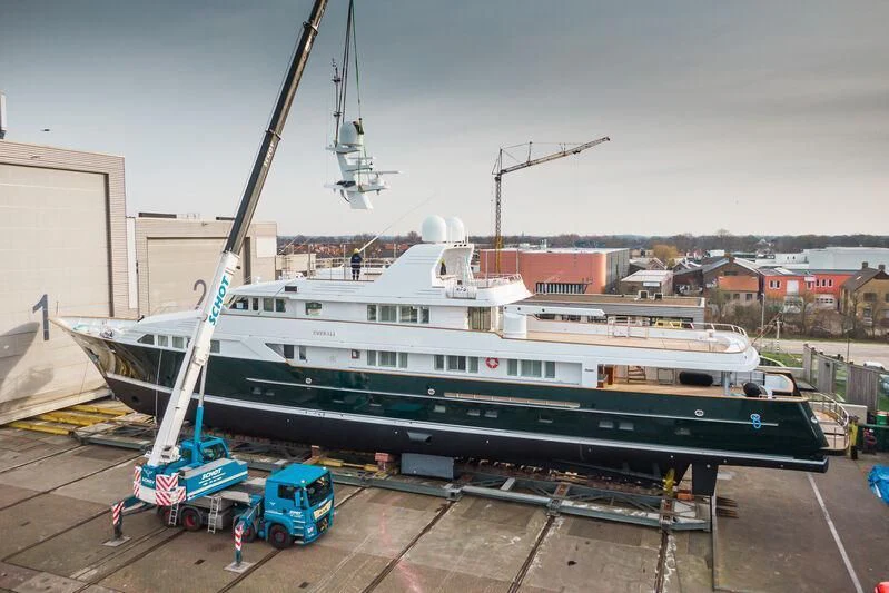 a large boat docked at a pier aboard EMERALD Yacht for Charter