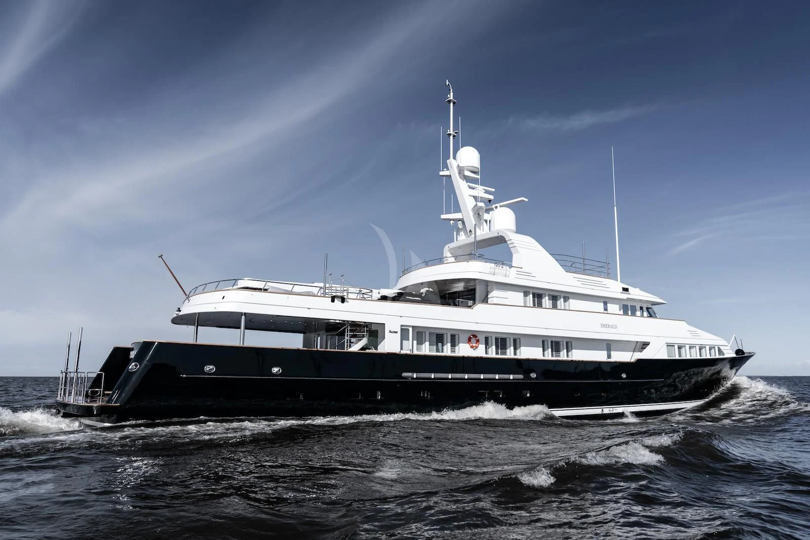 a large white boat on the water aboard EMERALD Yacht for Charter
