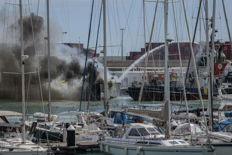 a marina with boats and buildings aboard PESA Yacht for Sale