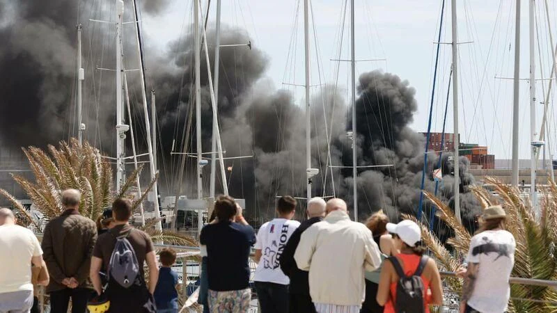 a group of people watching a large ship crash aboard PESA Yacht for Sale