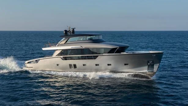 a white yacht on the water aboard PESA Yacht for Sale