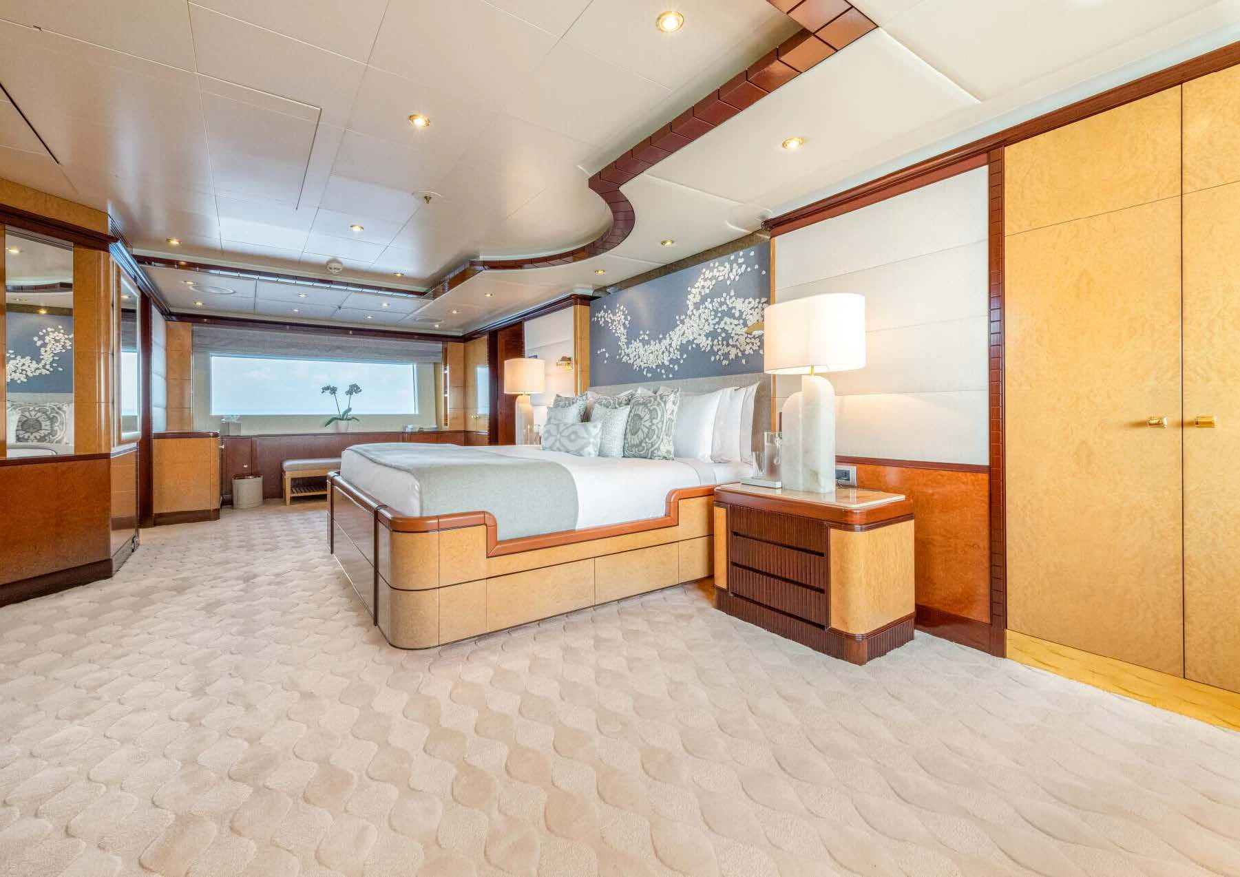 a large bedroom with a bed aboard JAGUAR Yacht for Charter