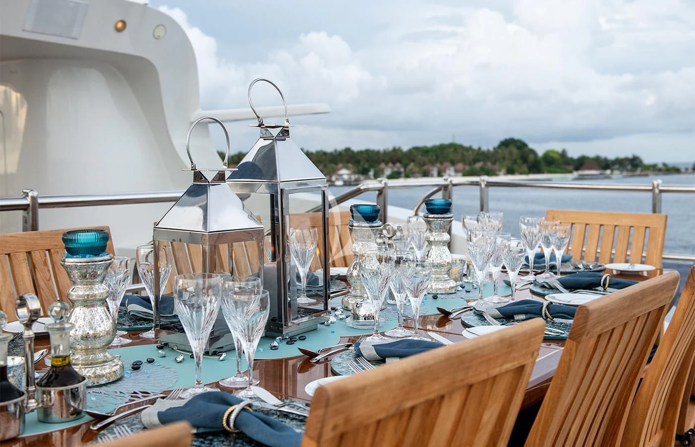 a table with glasses and a set of chairs on it aboard JAGUAR Yacht for Charter