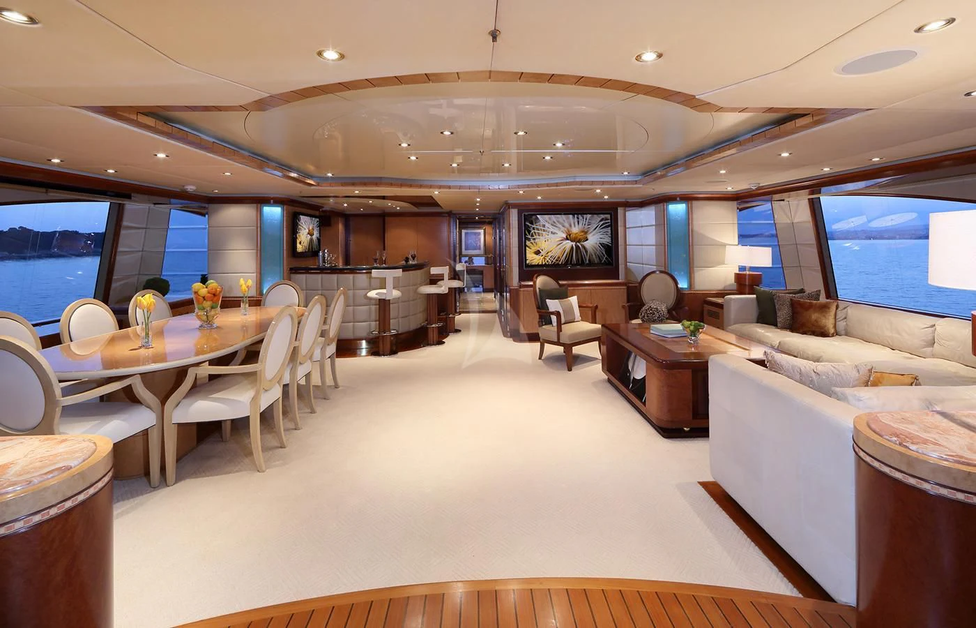 a large living room with a large window aboard JAGUAR Yacht for Charter