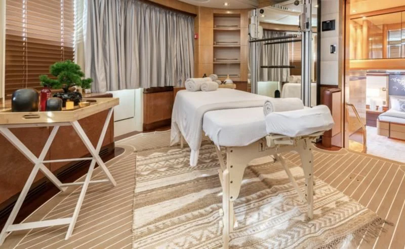 a room with a bed and a table aboard JAGUAR Yacht for Charter