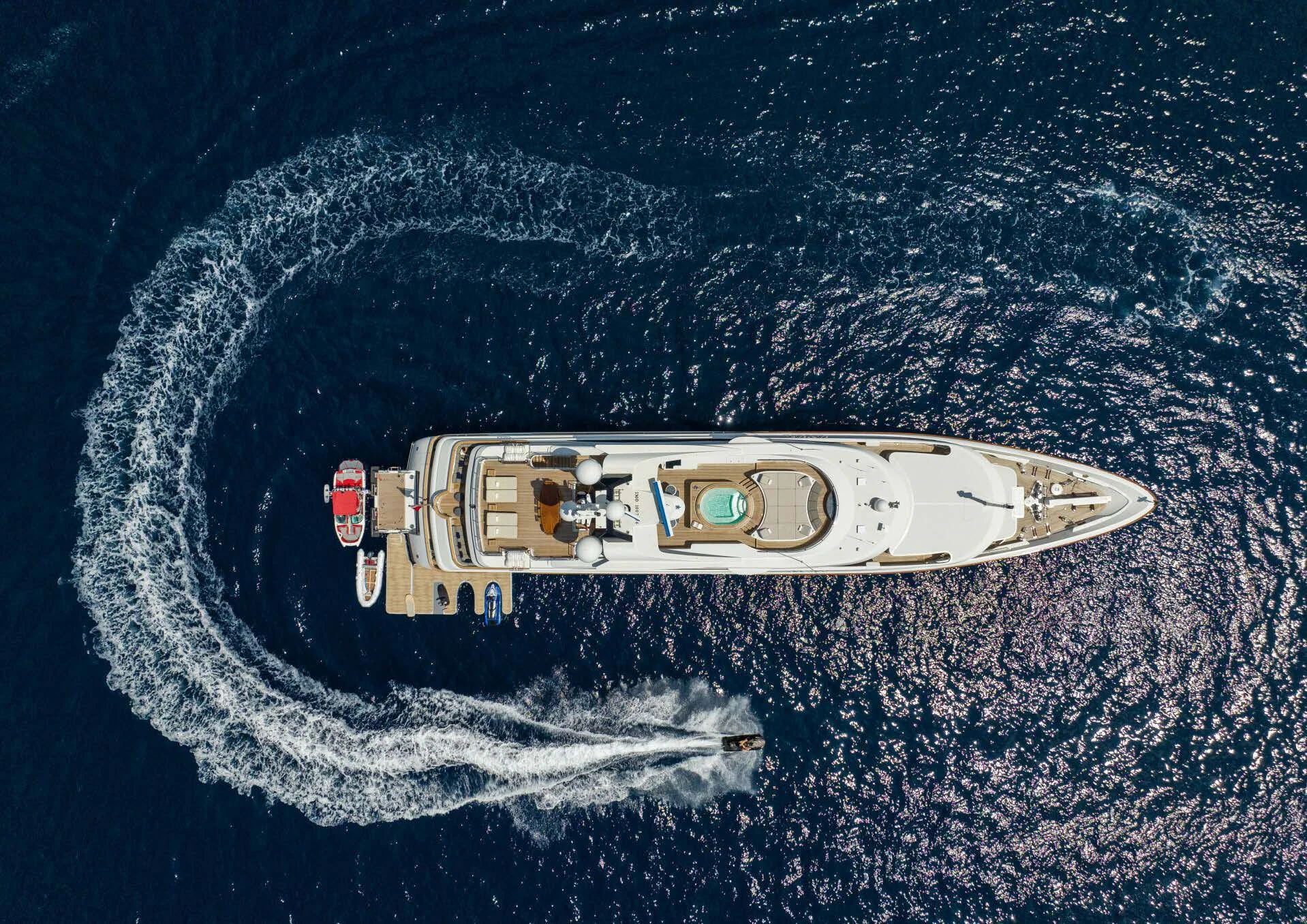 a space shuttle flying over a planet aboard JAGUAR Yacht for Charter