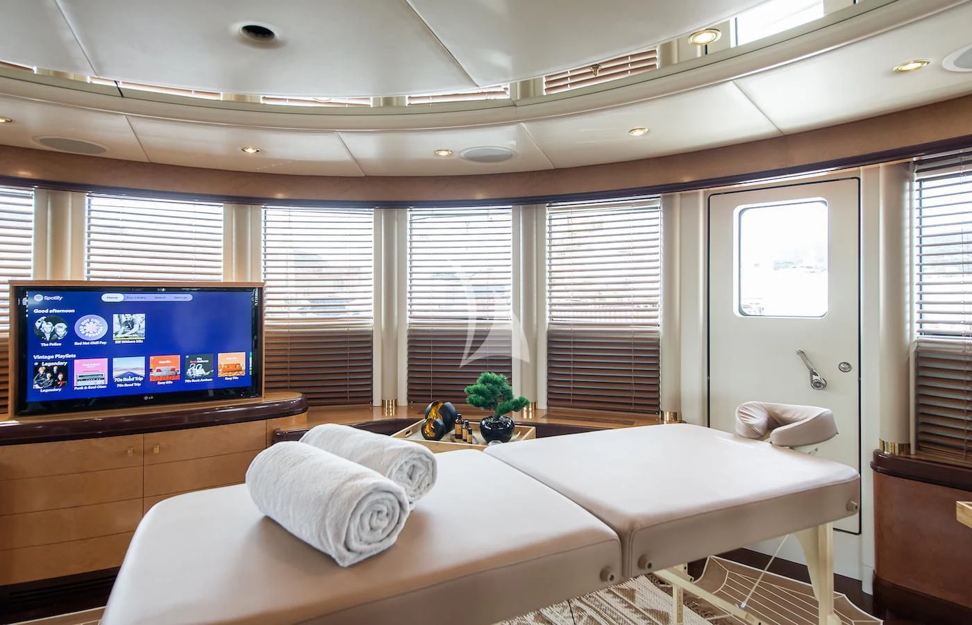 a room with a tv and a couch aboard JAGUAR Yacht for Charter
