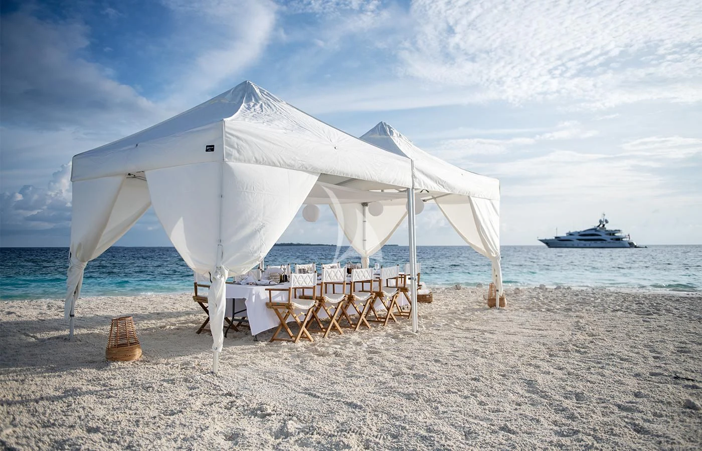 a white tent on a beach aboard JAGUAR Yacht for Charter
