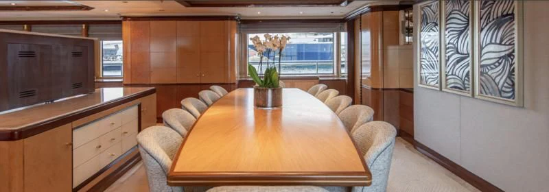 a room with a table and couches aboard JAGUAR Yacht for Charter