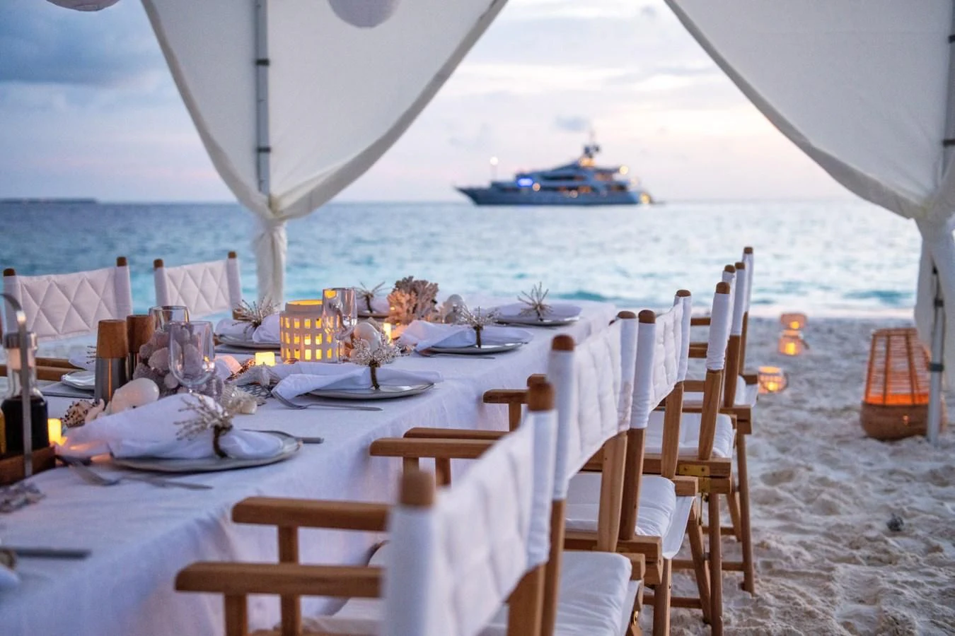 a table set for dinner on the beach aboard JAGUAR Yacht for Charter
