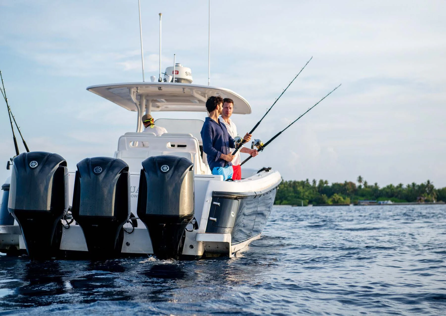 a couple of men on a boat aboard JAGUAR Yacht for Charter