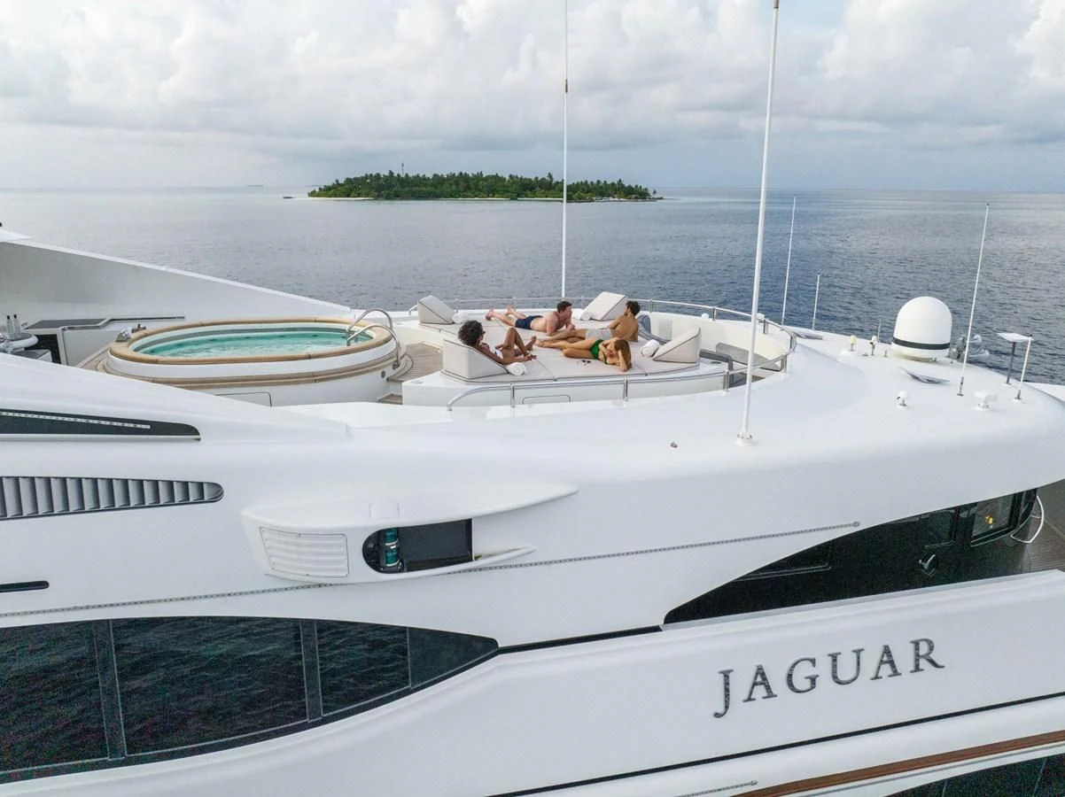 a group of people on a boat aboard JAGUAR Yacht for Charter