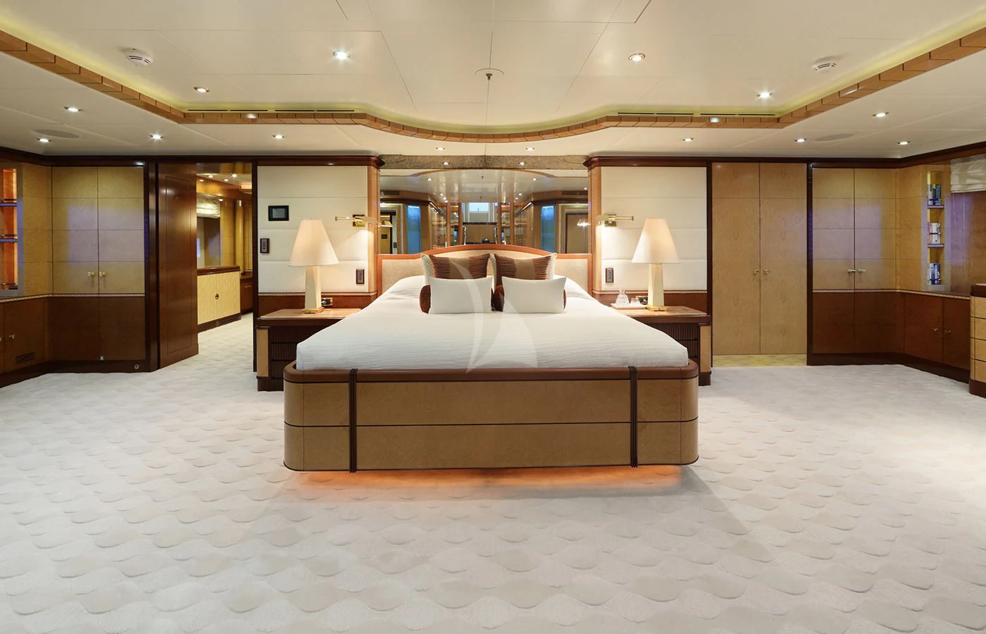 a large hotel room with a large bed aboard JAGUAR Yacht for Charter