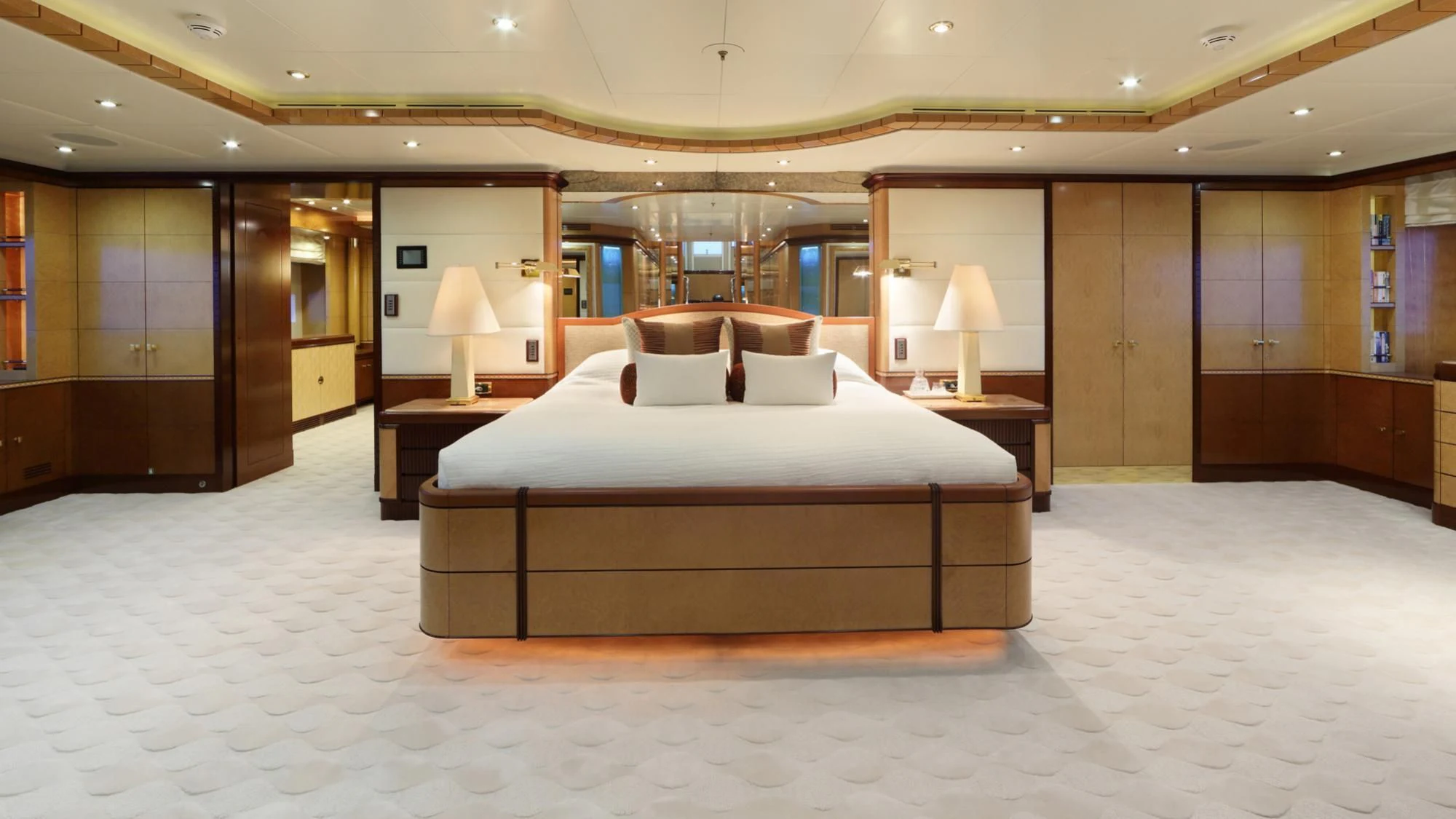 a large hotel room with a large bed aboard JAGUAR Yacht for Charter