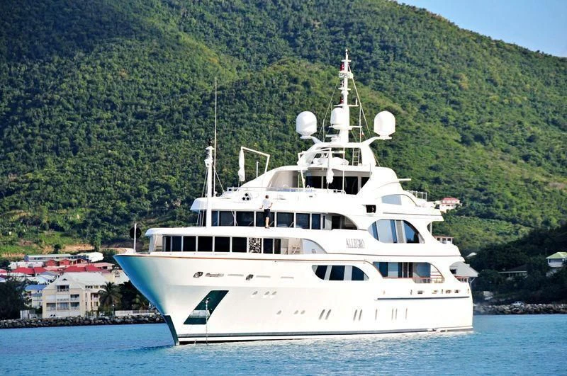 a large white boat in the water aboard JAGUAR Yacht for Charter