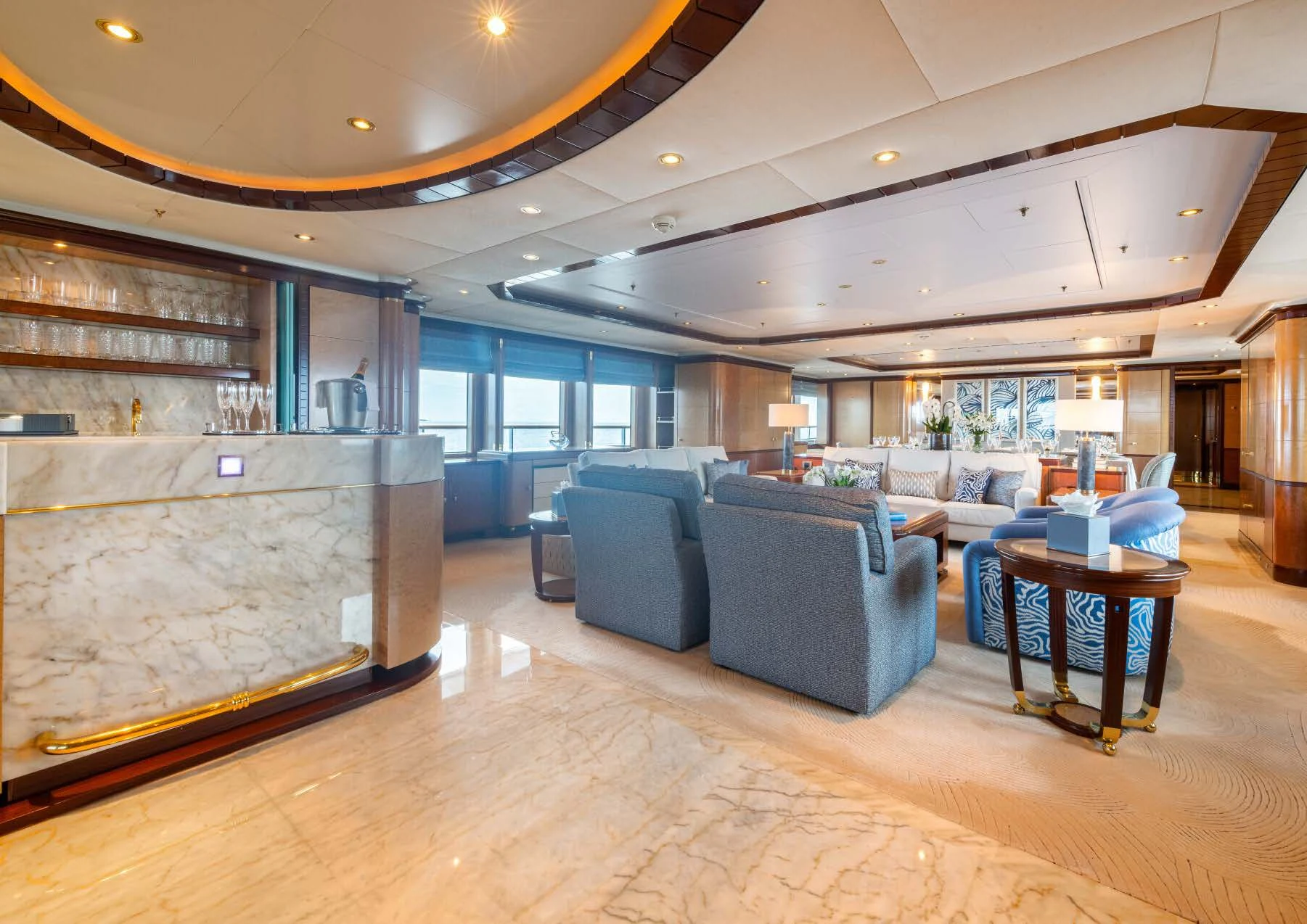 a large living room with a large glass wall aboard JAGUAR Yacht for Charter