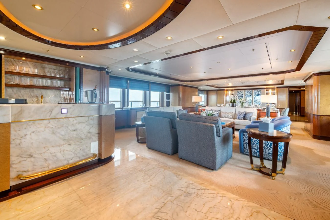 a large living room with a large glass wall aboard JAGUAR Yacht for Charter