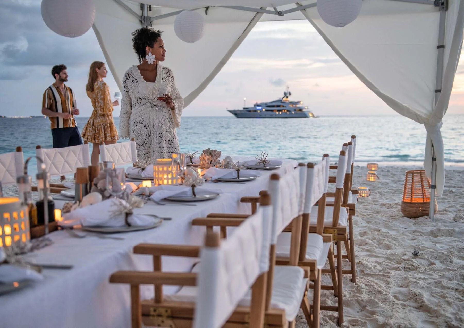 a group of people on a beach aboard JAGUAR Yacht for Charter