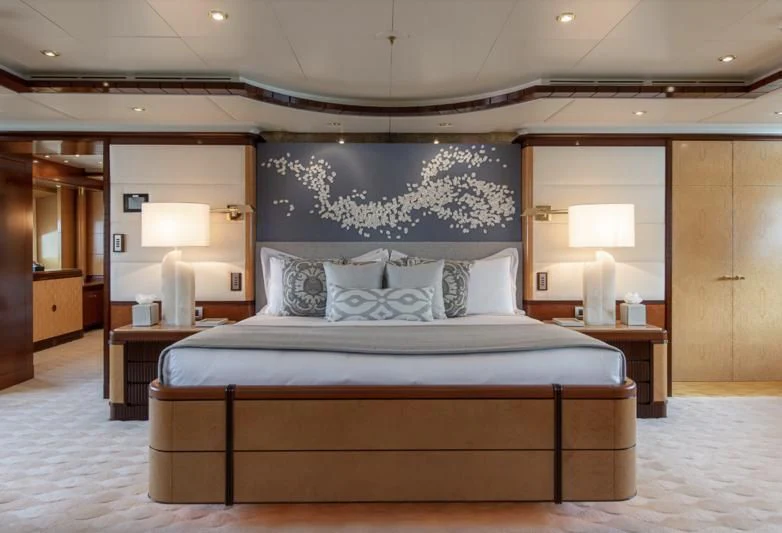 a large bed in a hotel room aboard JAGUAR Yacht for Charter