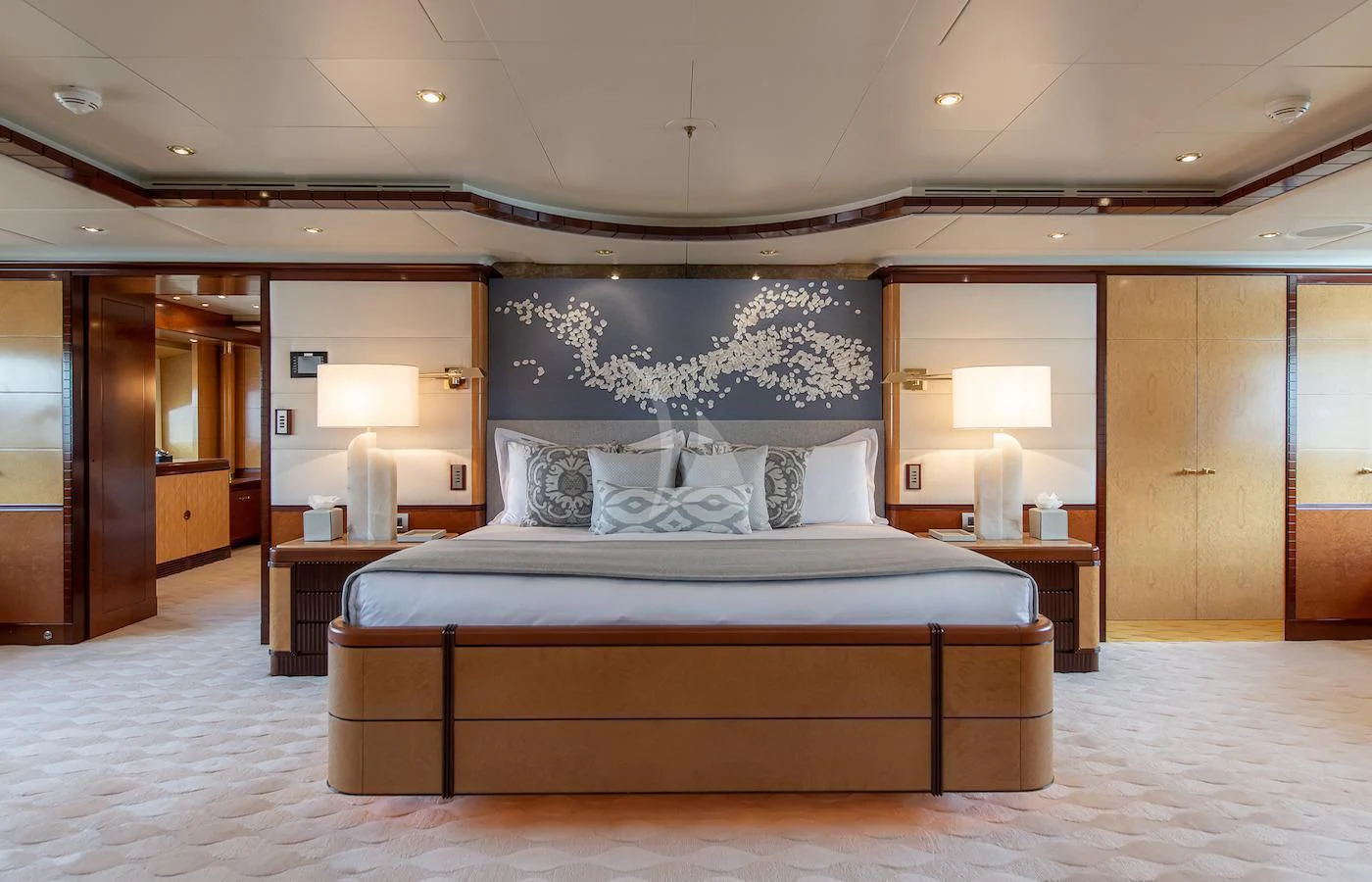 a large bedroom with a large bed aboard JAGUAR Yacht for Charter