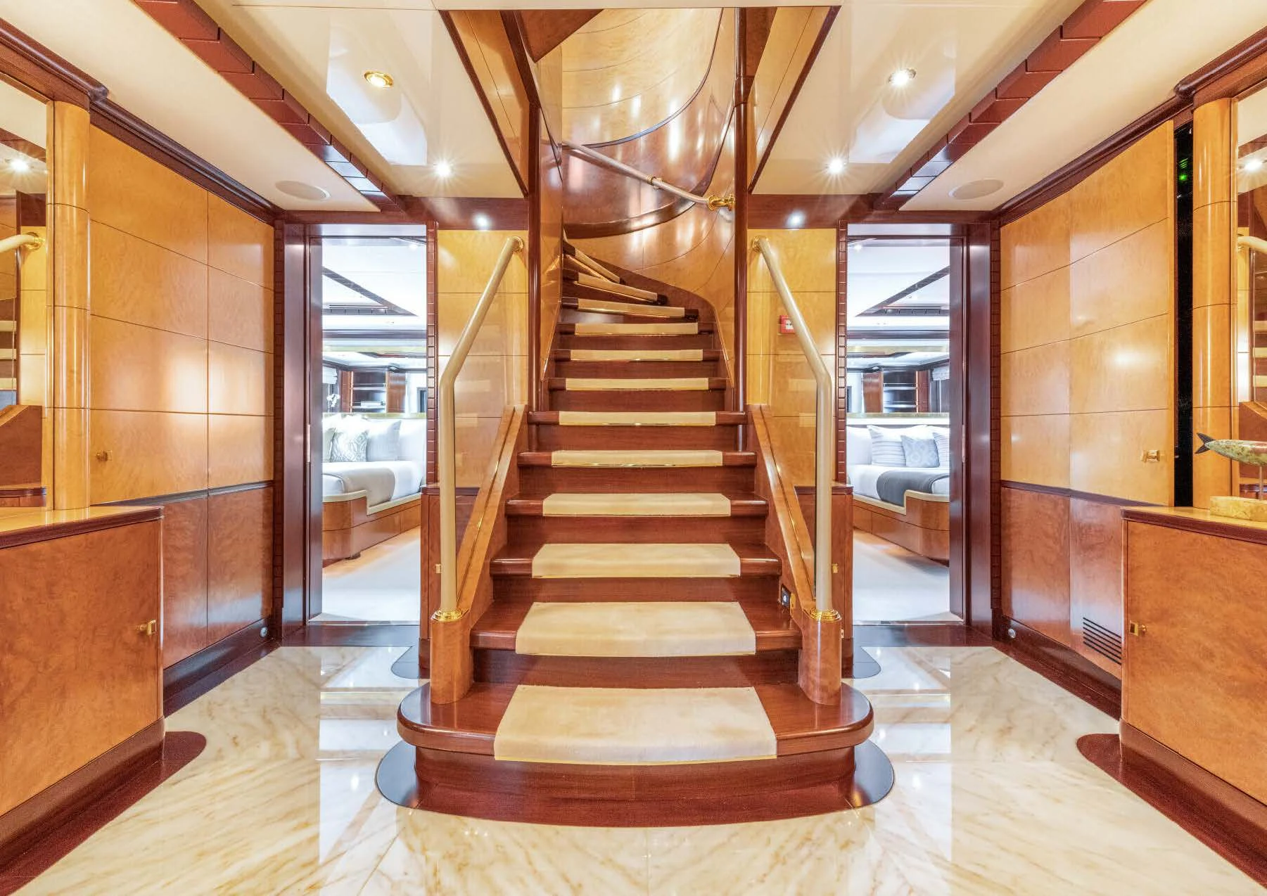 a long hallway with glass doors aboard JAGUAR Yacht for Charter