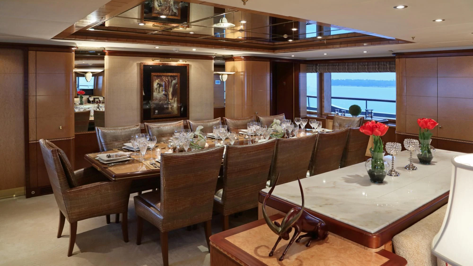 a large room with a table and chairs aboard JAGUAR Yacht for Charter