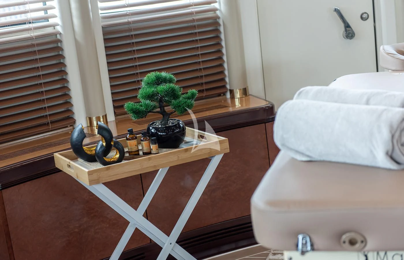 a small table with a plant on it aboard JAGUAR Yacht for Charter