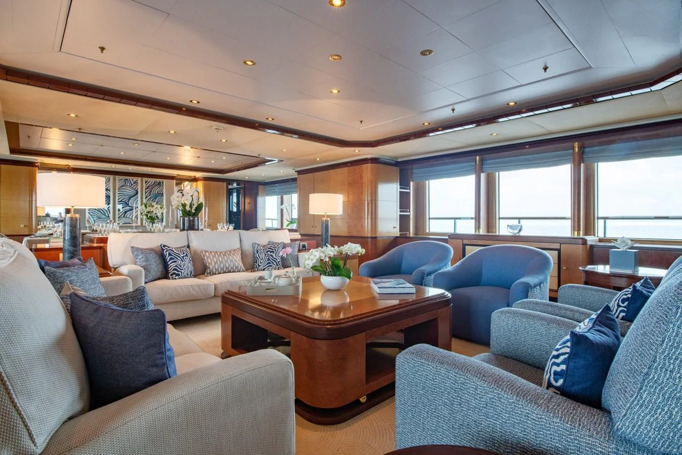 a living room with a table and couches aboard JAGUAR Yacht for Charter