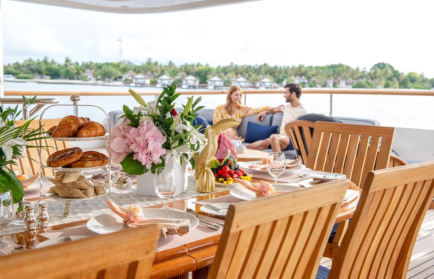 a couple sitting at a table aboard JAGUAR Yacht for Charter