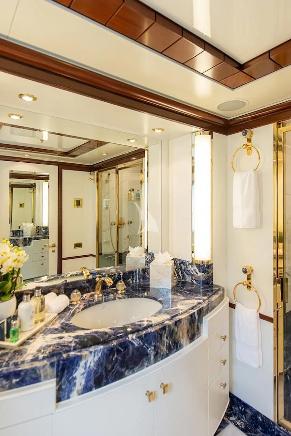 a bathroom with a large mirror aboard JAGUAR Yacht for Charter